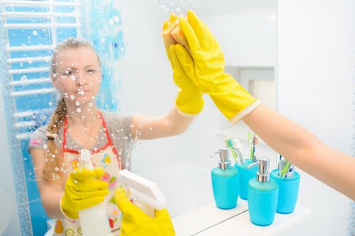 Cleaner organizing a short-term rental turnover checklist