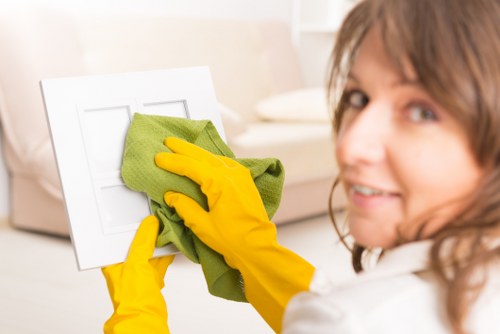 Kitchen surfaces being wiped during domestic cleaning